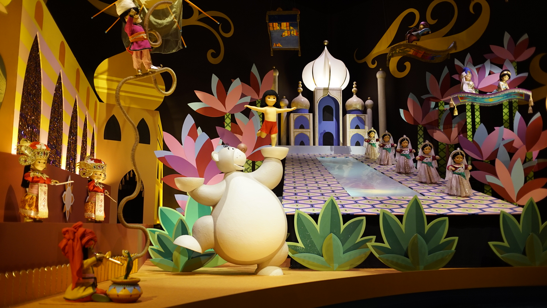 Baloo and Mowgli pose while Aladdin and Jasmine take a Magic Carpet ride on "it's a small world", Tokyo Disneyland