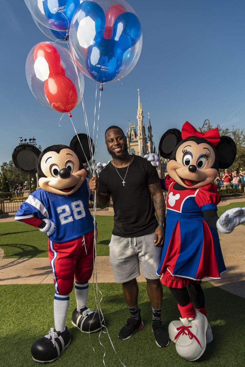 NFL Super Bowl star running back James White joins Mickey Mouse and Minnie Mouse after starring in a milestone Disney moment Monday, Feb. 6, 2017 (Matt Stroshane, photographer)