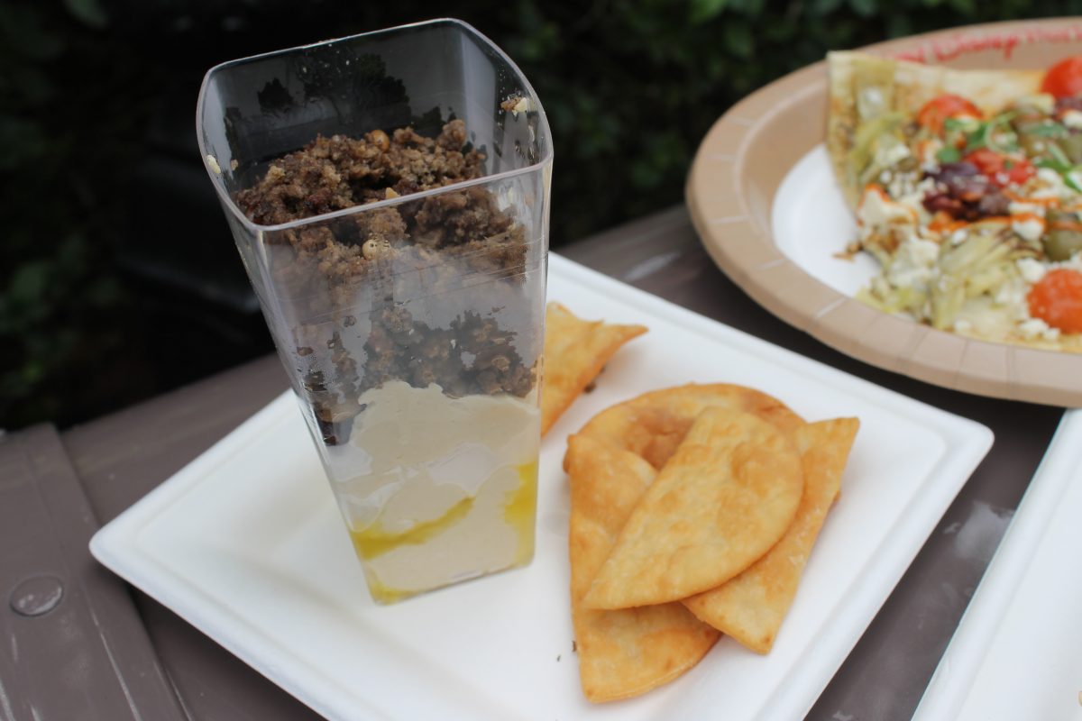 Hummus Trifle: Layered Hummus topped with Spiced Beef, Pine Nuts and Dry Cherries, served with Pita Chips $9.00