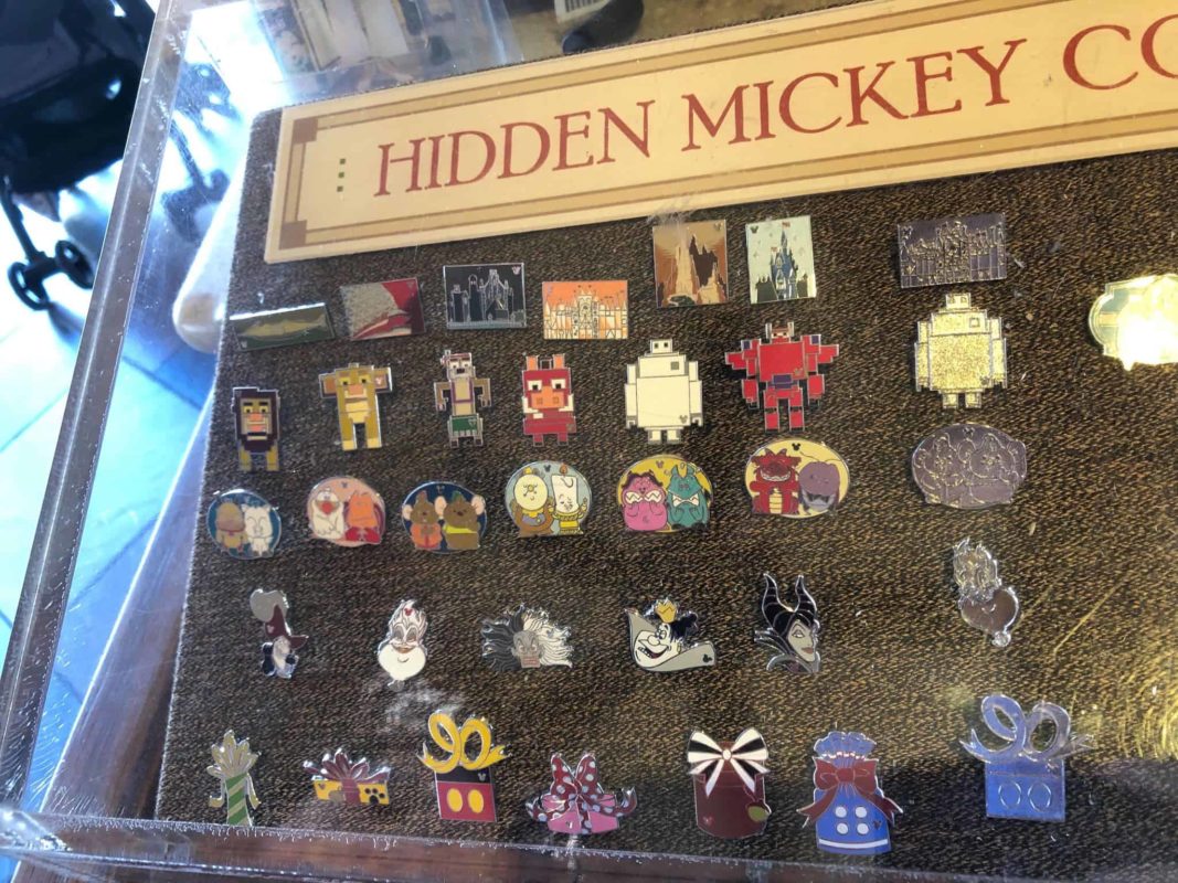 Disney Attractions hidden mickey park icons it's a small world Pin