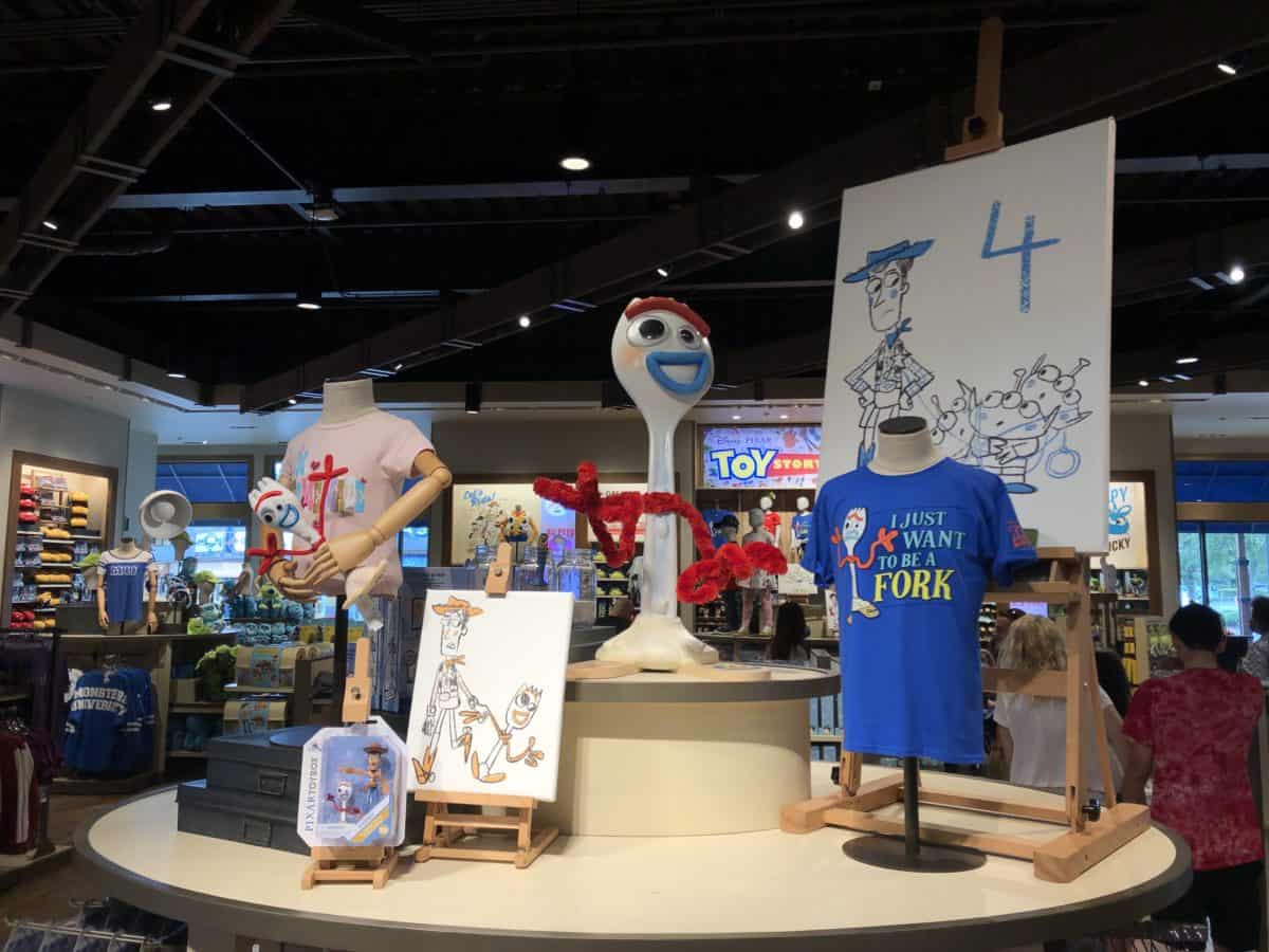 Toy Story 4 merchandise is on display at World of Disney with a giant Forky characer and Forky merchandise on display.