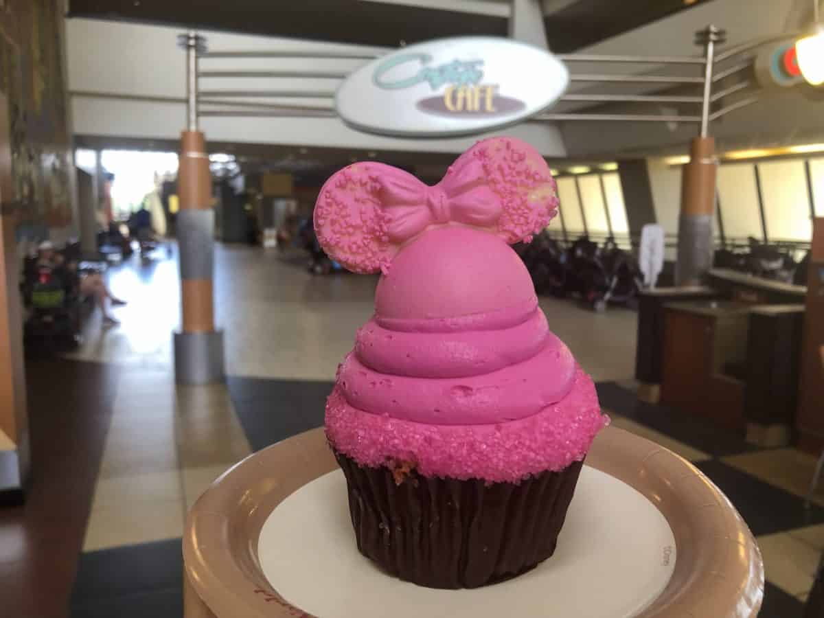 Strawberry cupcake with bright pink vanilla frosting and Imagination Pink mickey ears of white chocolate