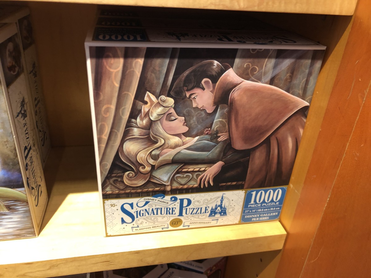 NIB Disneyland 60th Anniversary Set Of Four 500 piece Signature Puzzles.