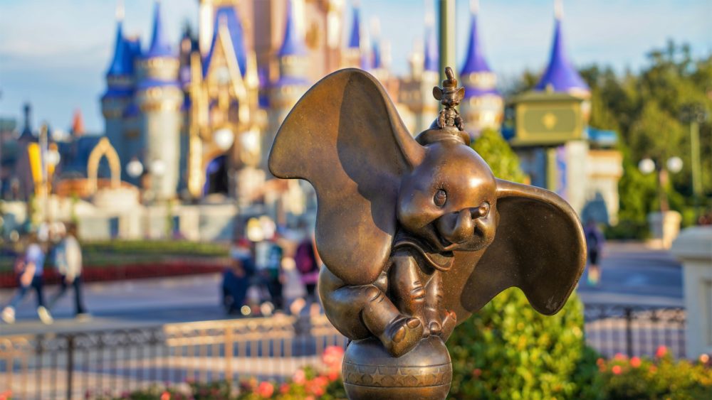 Bronze Dumbo Figure in Magic Kingdom Hub with Cinderella Castle in Background