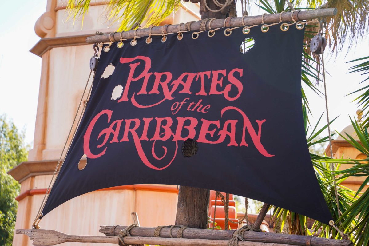 magic kingdom disney pirates of the caribbean ride logo