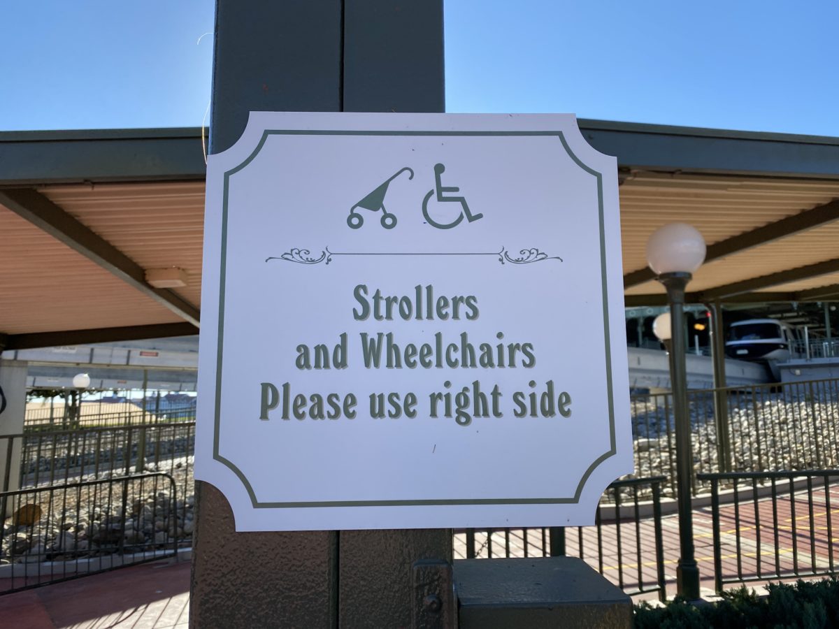 strollers-and-wheelchairs-to-the-right-monorail-sign-detail-magic-kingdom-02022021-9307806