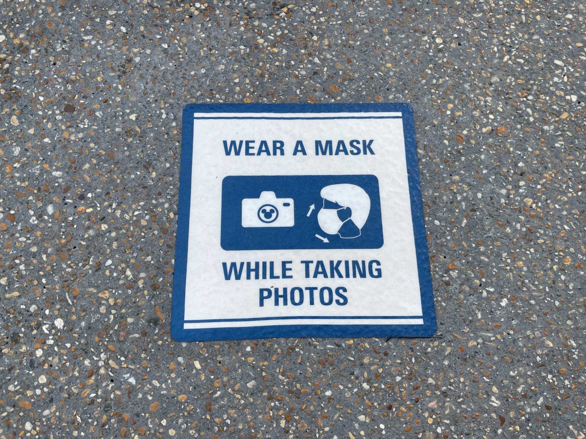 new ground markers wear mask while taking photos