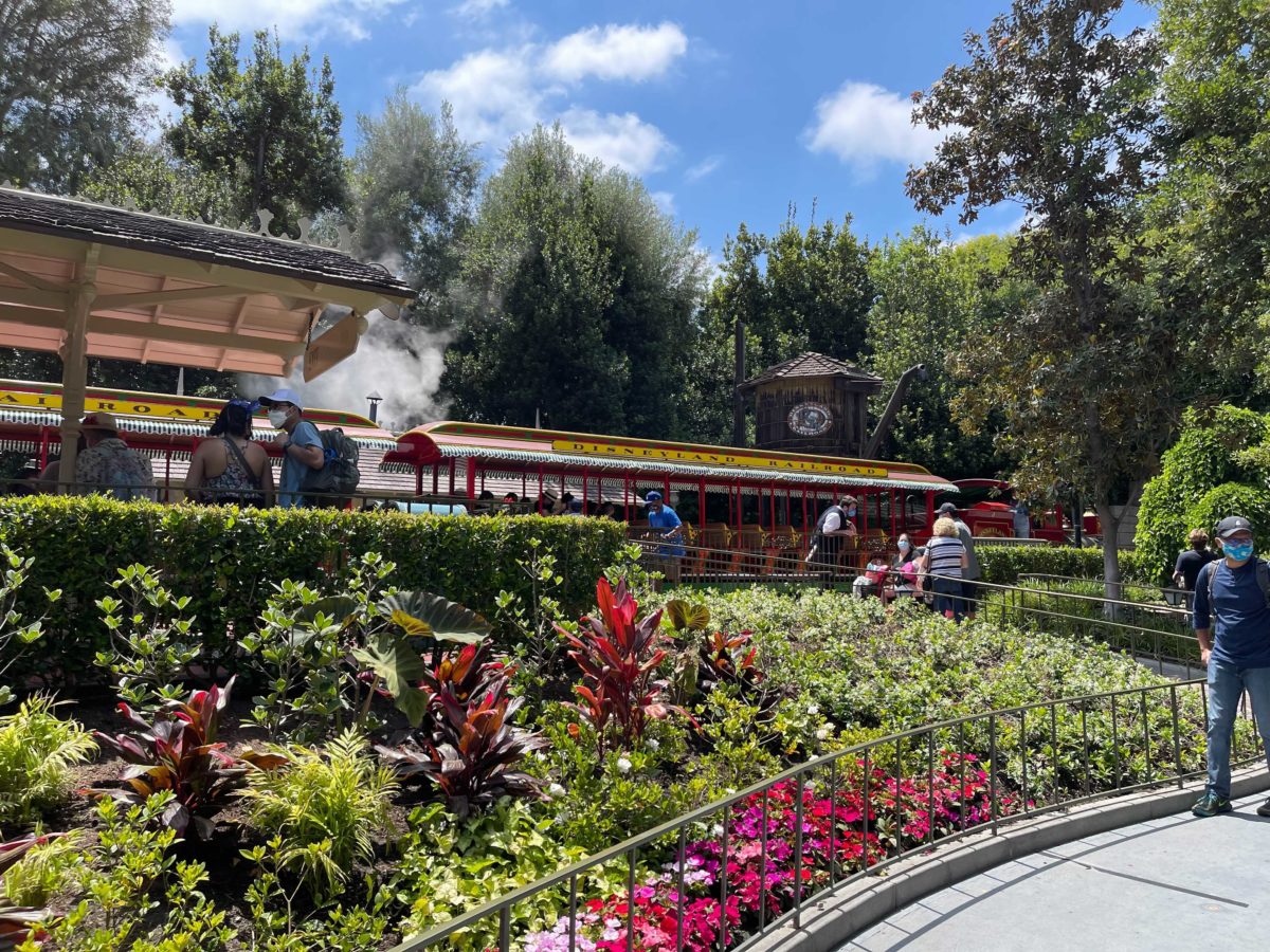 Guests wait in line to board the Disneyland Railroad at New Orleans Square Station