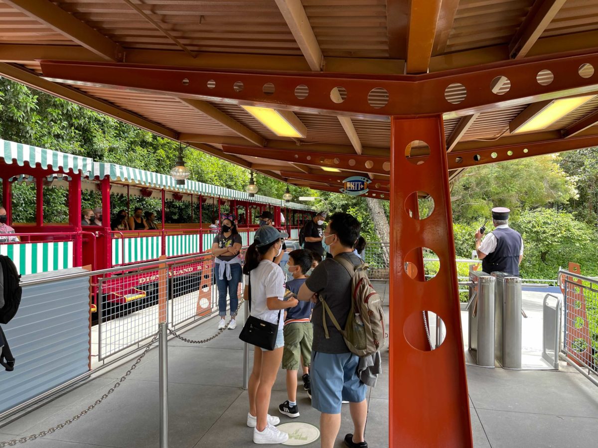 Guests wait in line to board the Disneyland Railroad at Tomorrowland Station
