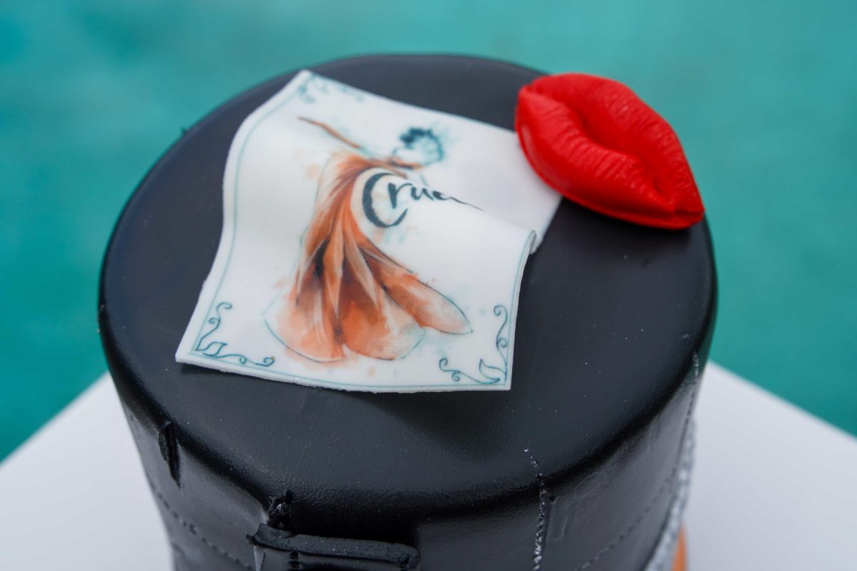 The new Cruella Petit cake available at Amorette's Patisserie in Disney Springs is a delicious and stylish dessert worth trying. Here the dessert features a fashion illustration of Cruella.