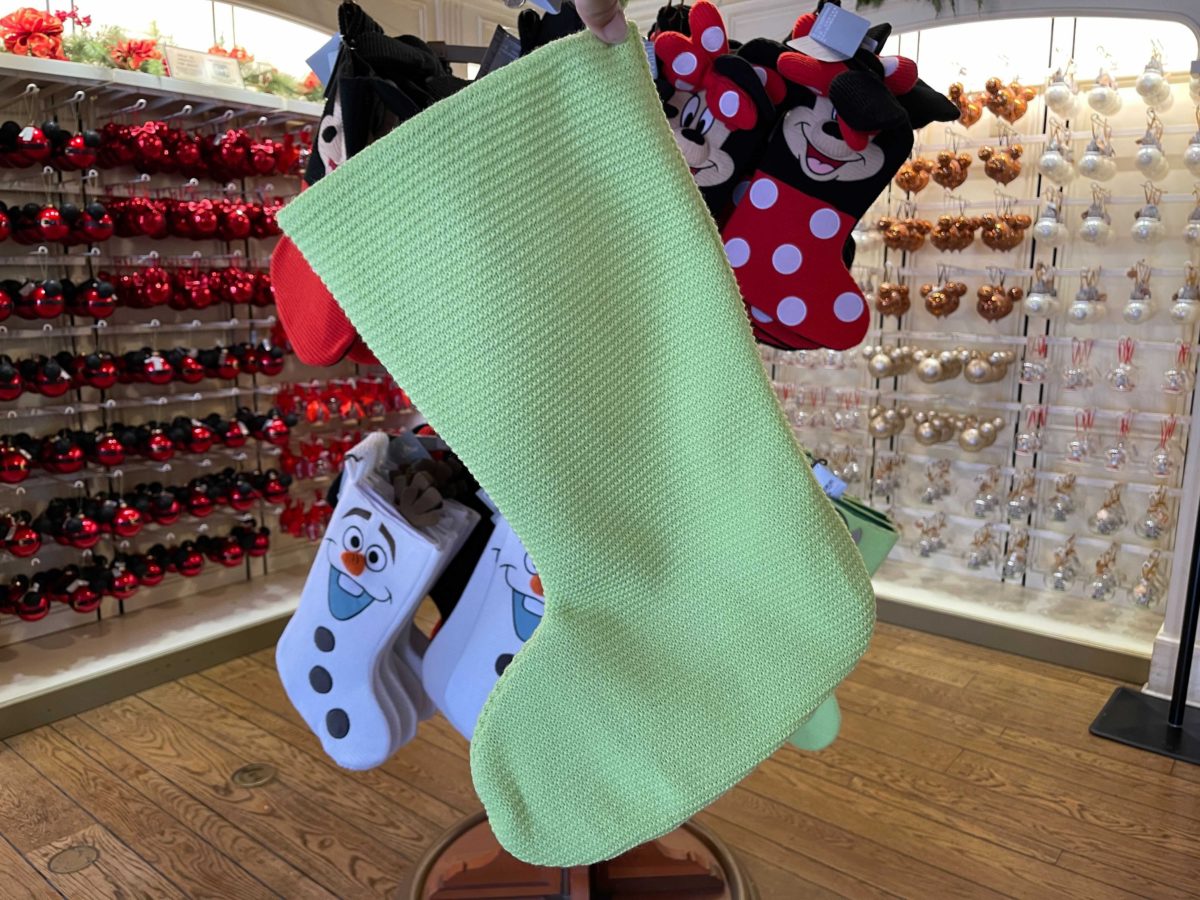 New Monsters, Inc. stockings featuring Mike Wazowski at Ye Olde Christmas Shoppe in Magic Kingdom at Walt Disney World