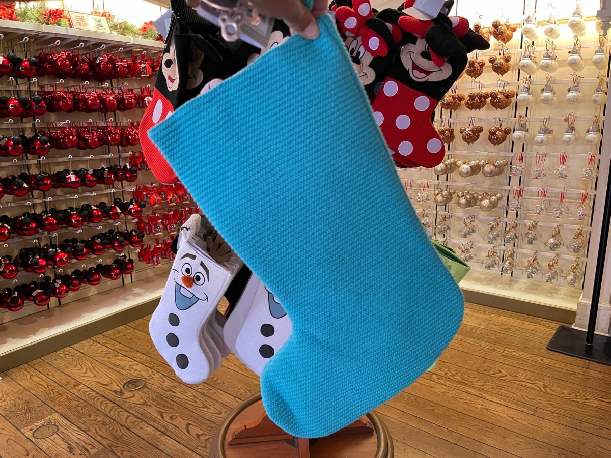 New Monsters, Inc. stockings featuring Sulley at Ye Olde Christmas Shoppe in Magic Kingdom at Walt Disney World