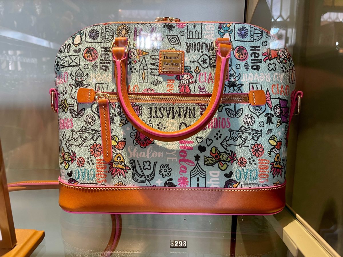 new dooney & bourke "it's a small world" collection at Uptown Jewelers in the Magic Kingdom at Walt Disney World