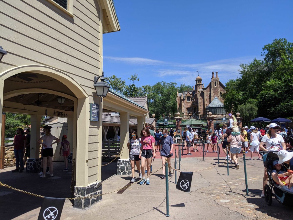 The Haunted Mansion at Magic Kingdom in Walt Disney World has had its extended queue markers for physical distancing removed. Guests are waiting in line.