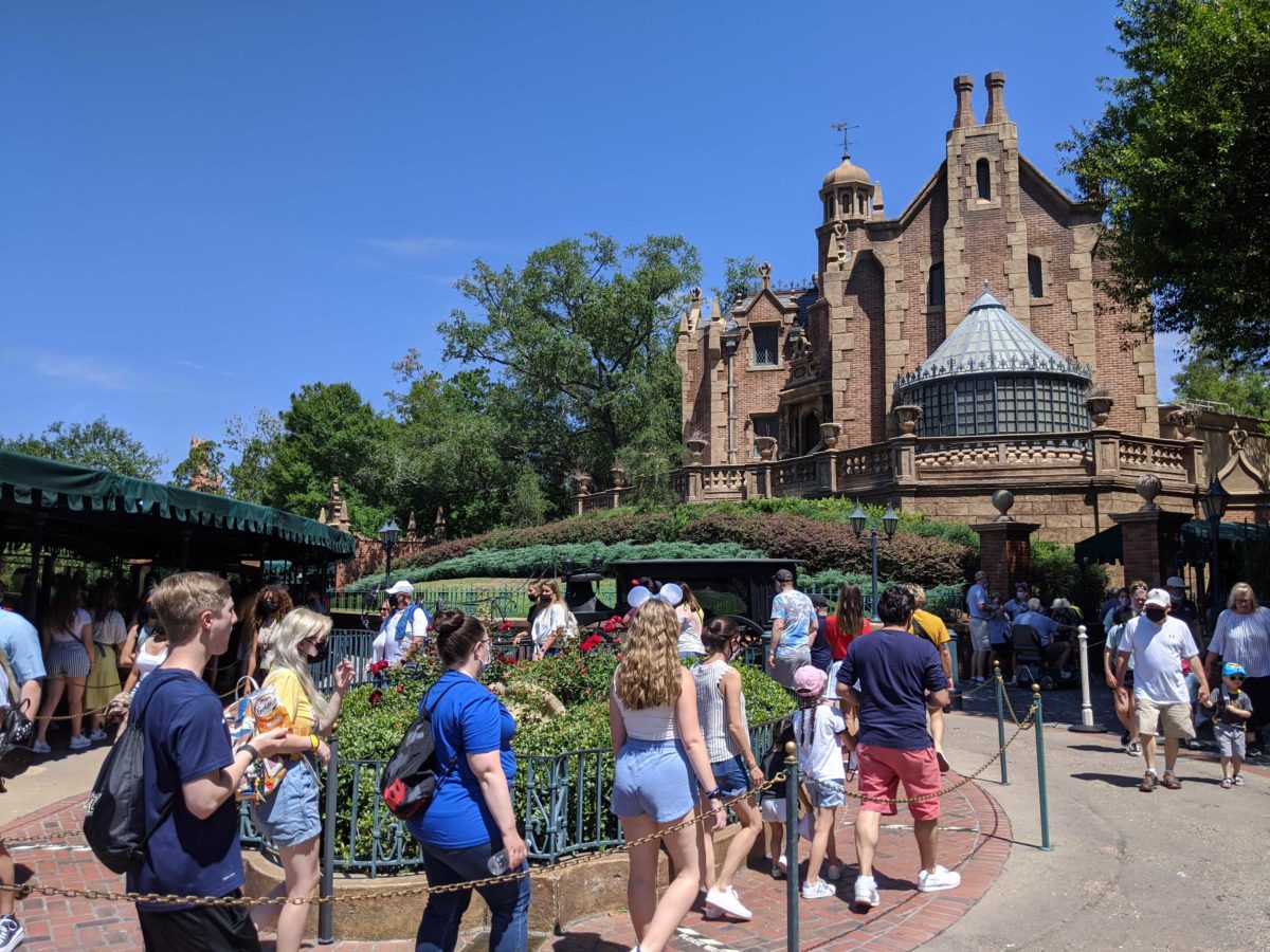 The Haunted Mansion at Magic Kingdom in Walt Disney World has had its extended queue markers for physical distancing removed. Guests are waiting in line.