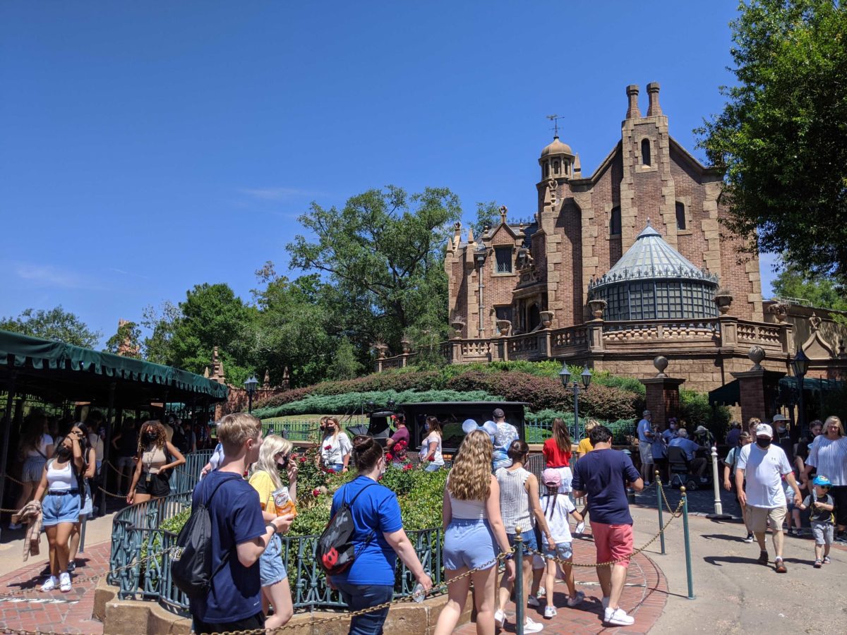The Haunted Mansion at Magic Kingdom in Walt Disney World has had its extended queue markers for physical distancing removed. Guests are waiting in line.