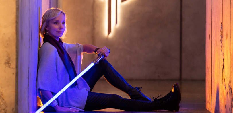 Guest posing with lightsaber for CSL Portrait Experience