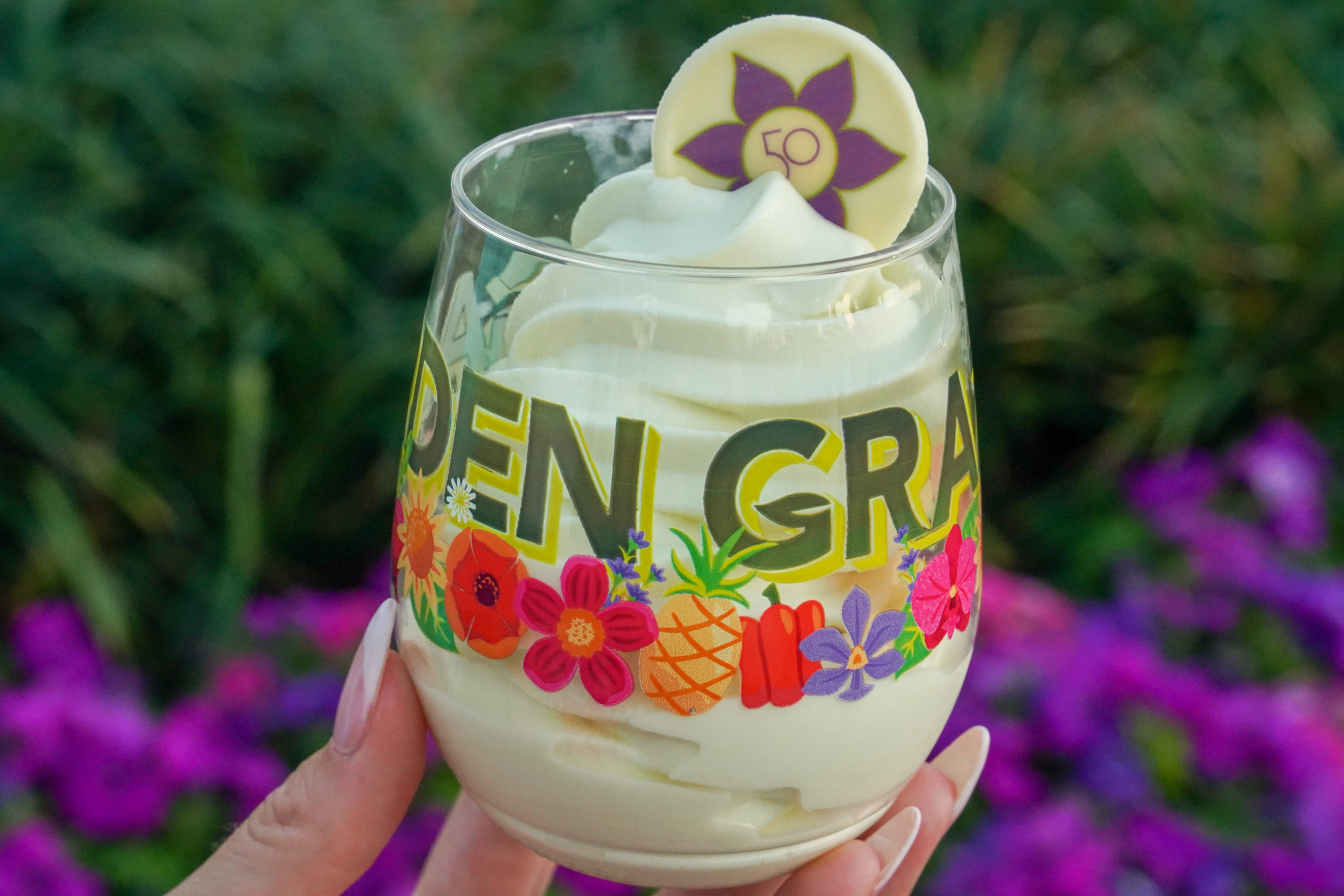 The prize cup and mango Dole Whip for the Epcot Flower and Garden Festival 2022 Garden Graze.
