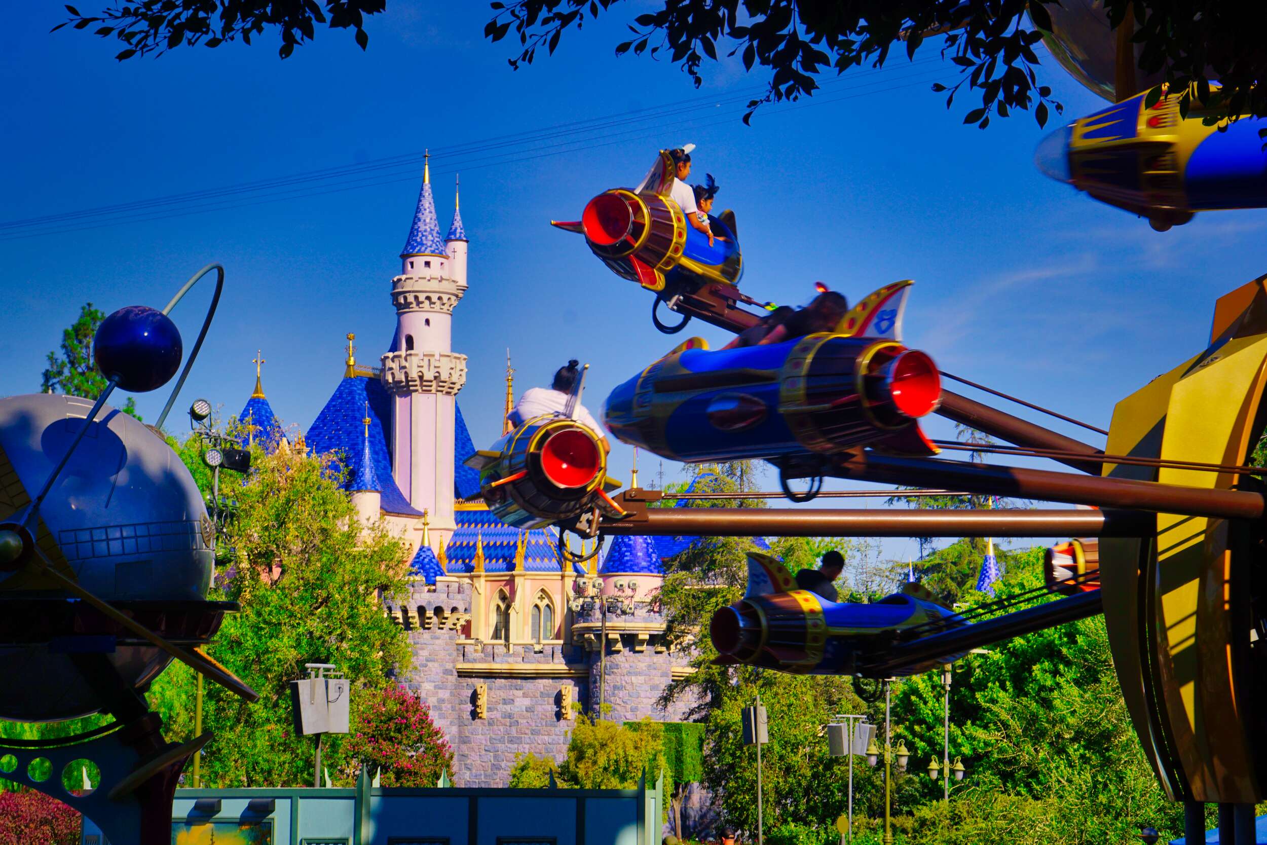 Sleeping Beauty Castle with Astro Orbiter Disneyland Stock