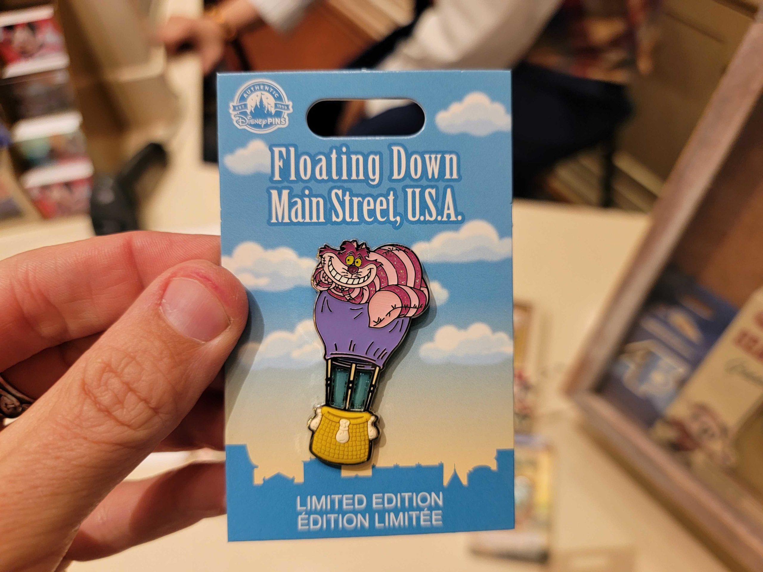 Floating Down Main Street Cheshire Cat pin LE