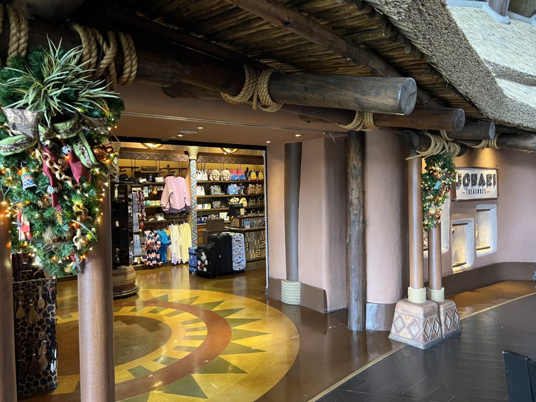 Garland on either side of the lobby on the posts disney animal kingdom lodge 2022 holidays