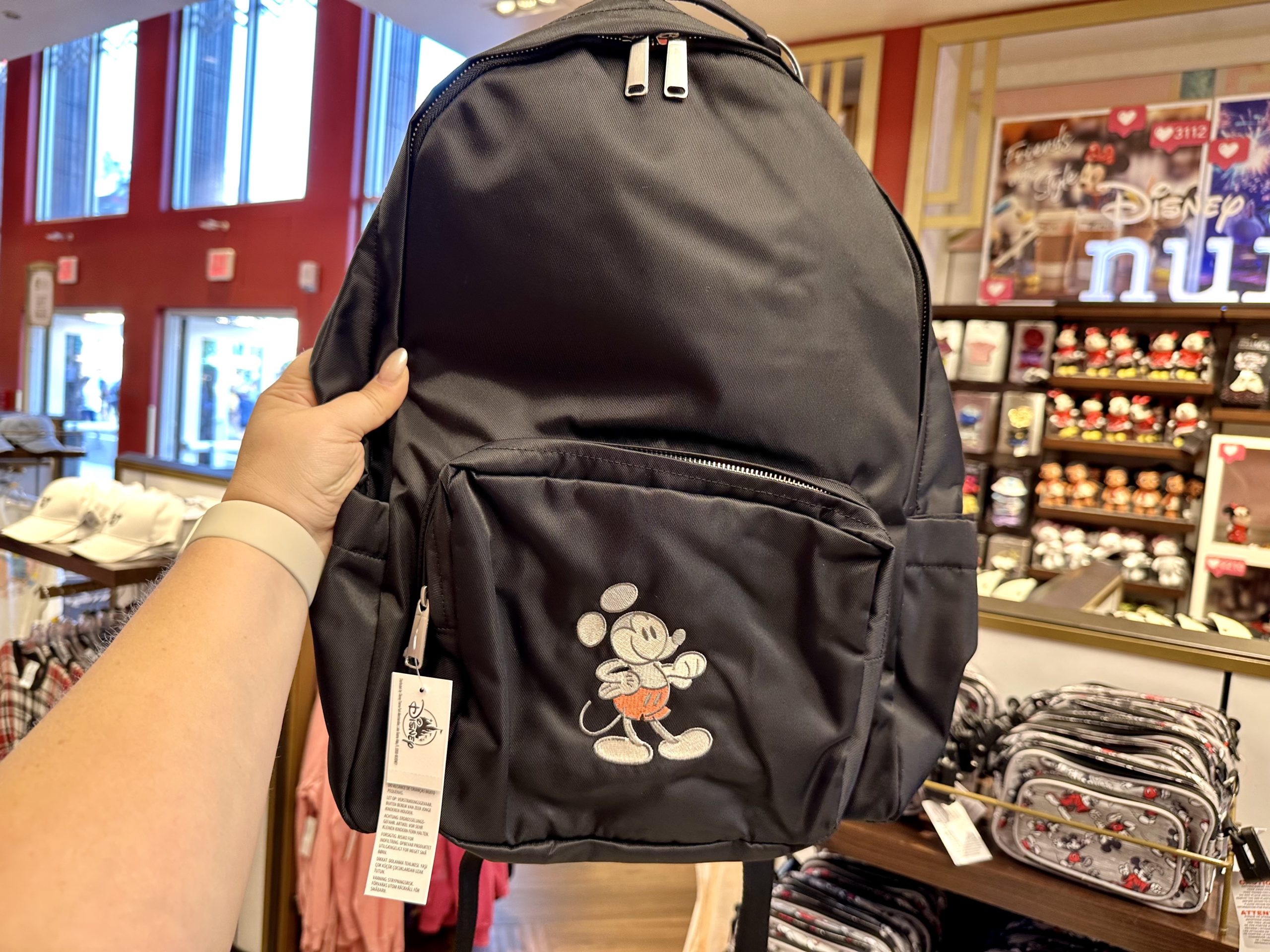 Mickey Mousewears black backpack scaled