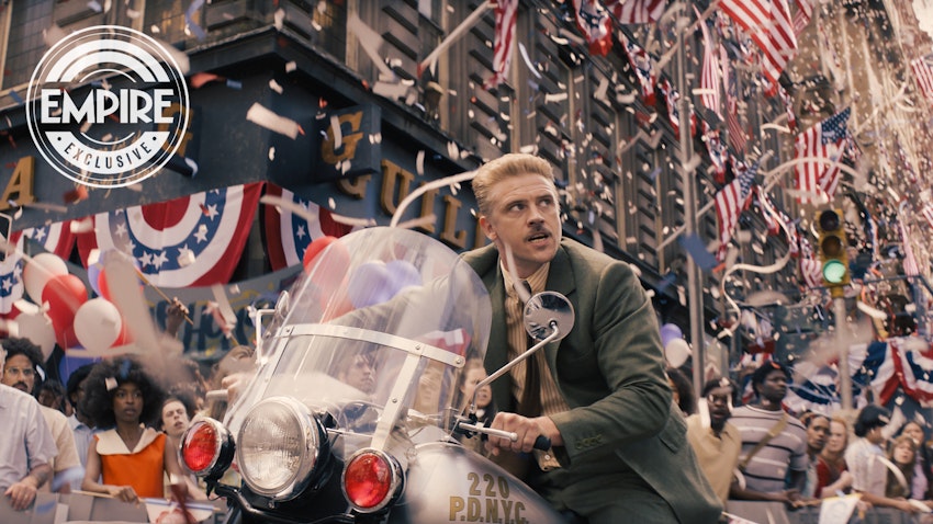 Boyd Holbrook as Klaber, driving a motorcycle through a parade in Indiana Jones 5