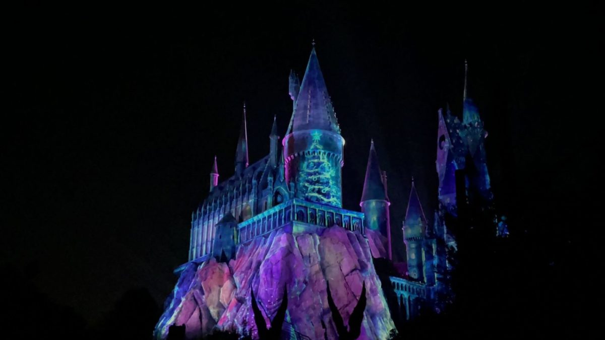 Magic of Christmas at Hogwarts Castle: Christmas tree projected on tower