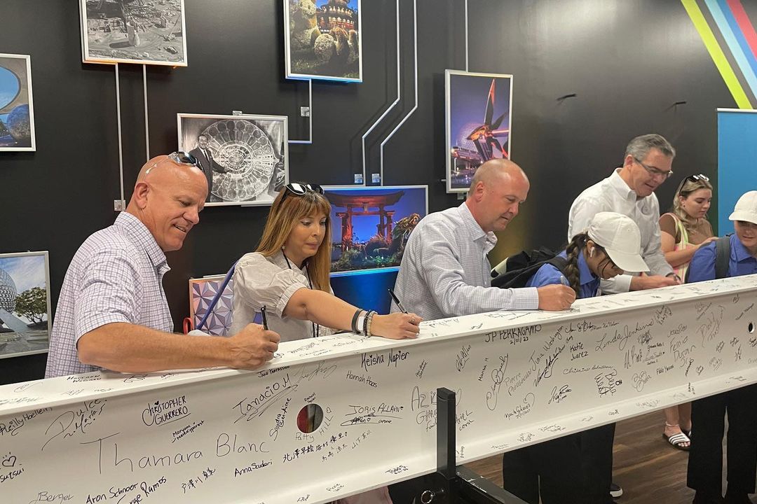 WDW Cast Members sign beam for Epcot IG2