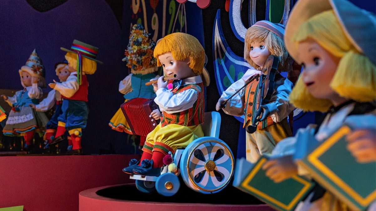 it's a small world doll in a wheelchair